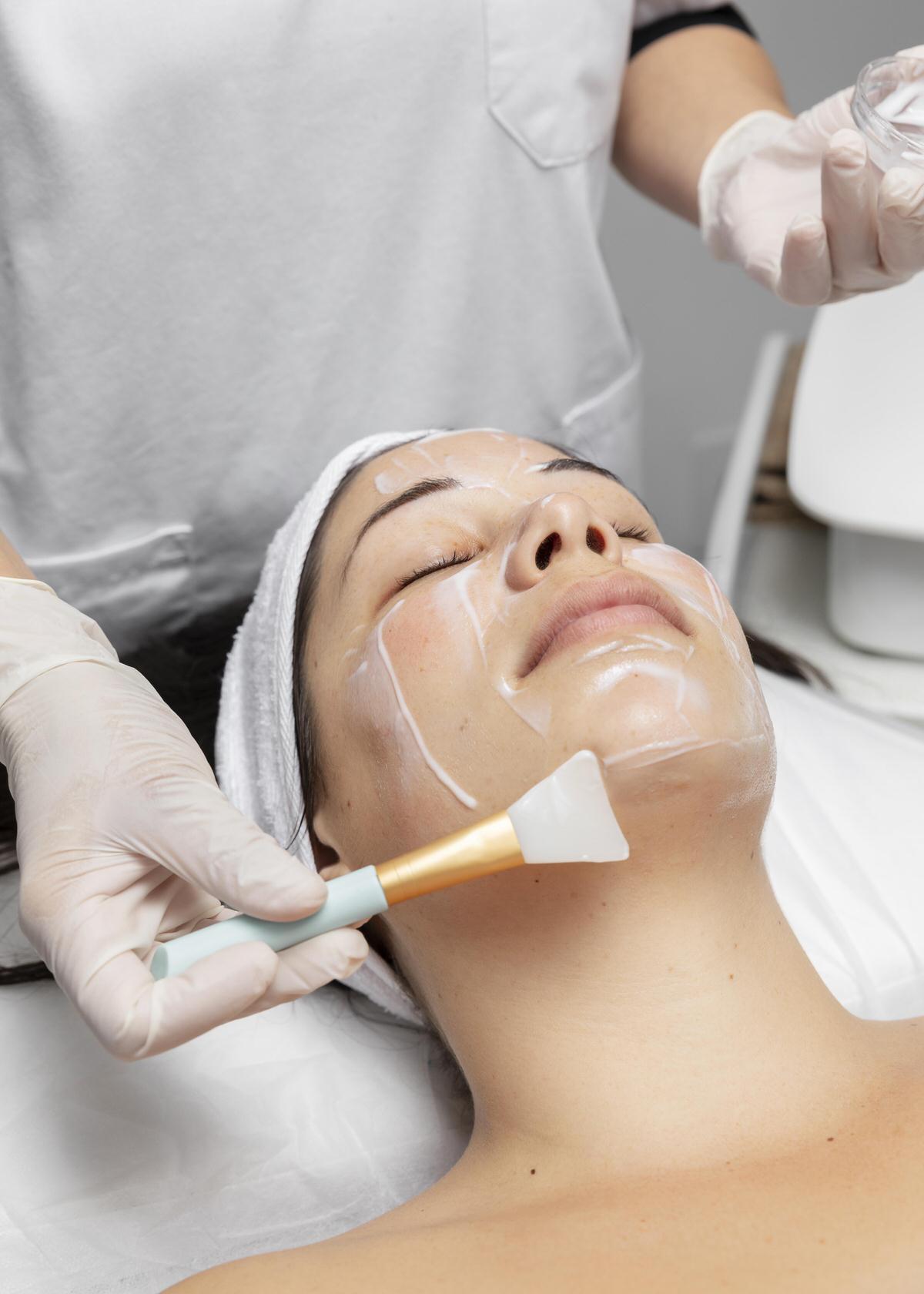 young-woman-having-facial-skincare-treatment young-woman-having-facial-skincare-treatment