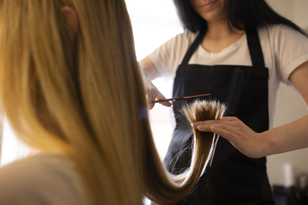 female-client-getting-her-hair-cut-hairdresser female-client-getting-her-hair-cut-hairdresser