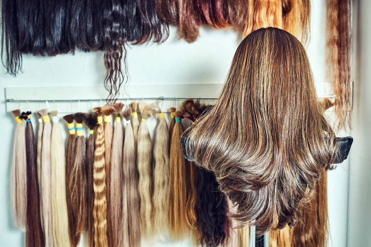 Premium hair extension palette with color samples from blonde to Hair extension equipment of natural hair. hair samples of different colors