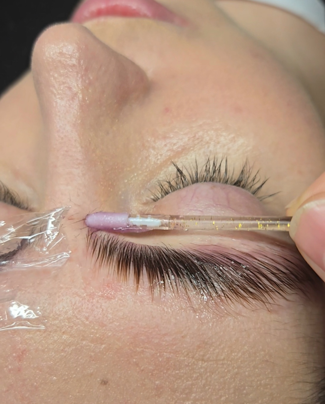 Professional brow lamination treatment in progress at Wink Lash Art in Old Town Alexandria, VA